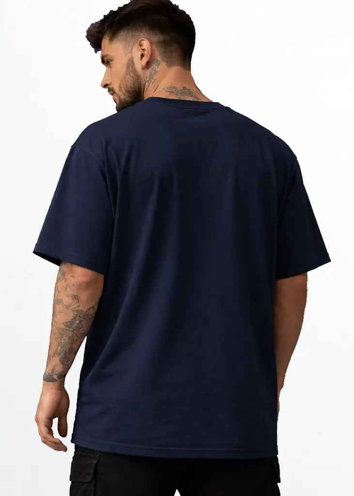 A young man wearing navy blue oversized tshirt back view